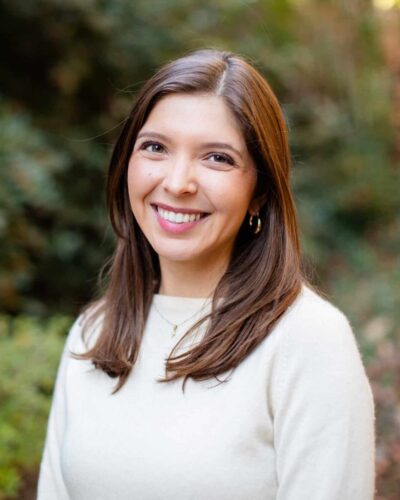 A Woman Smiling For The Camera